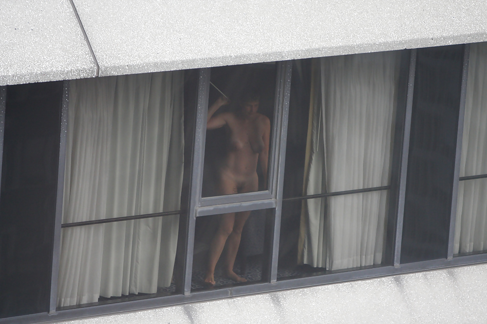 Mature gets fucked hotel window photo
