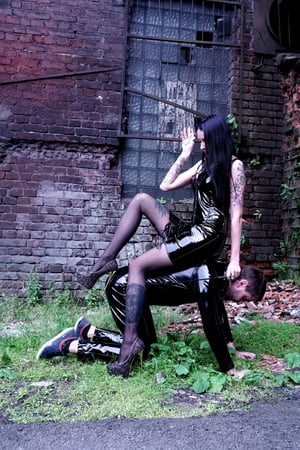 dominatrix nika on a walk with her slave         