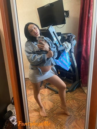 pregnant brunette in sheer pantyhose         