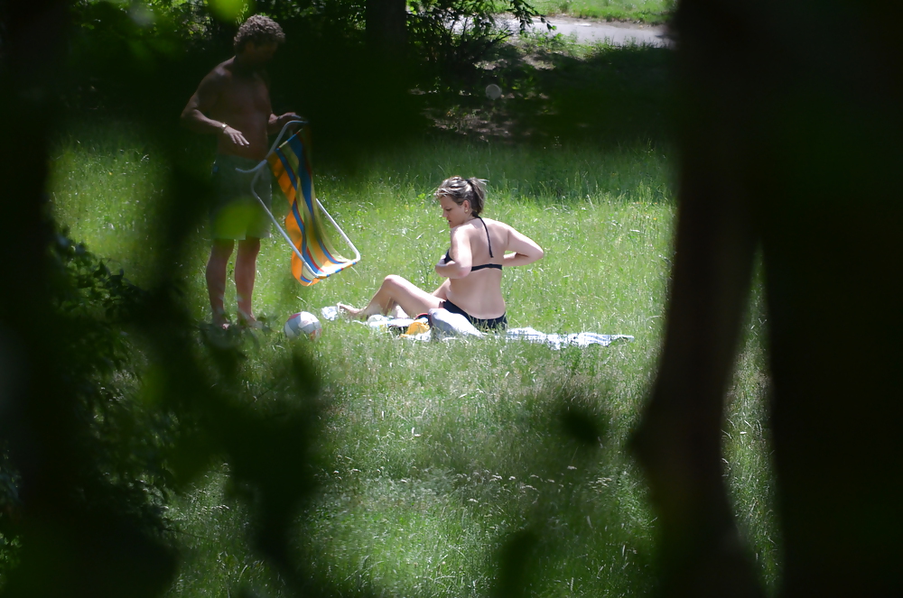 Sex girl sunbathing in the park I image