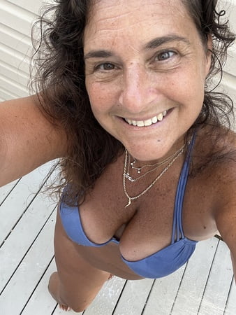 sunning in sexy purple bikini         