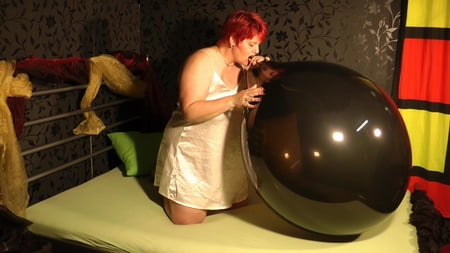 black balloon golden heels red fingernails         