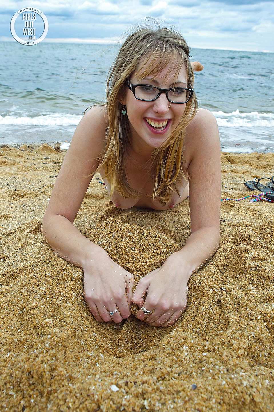 Sex Lovely nerdy blondie toying her hole on the beach image