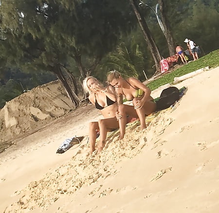 2 blonde sluts with big tits in bikinis