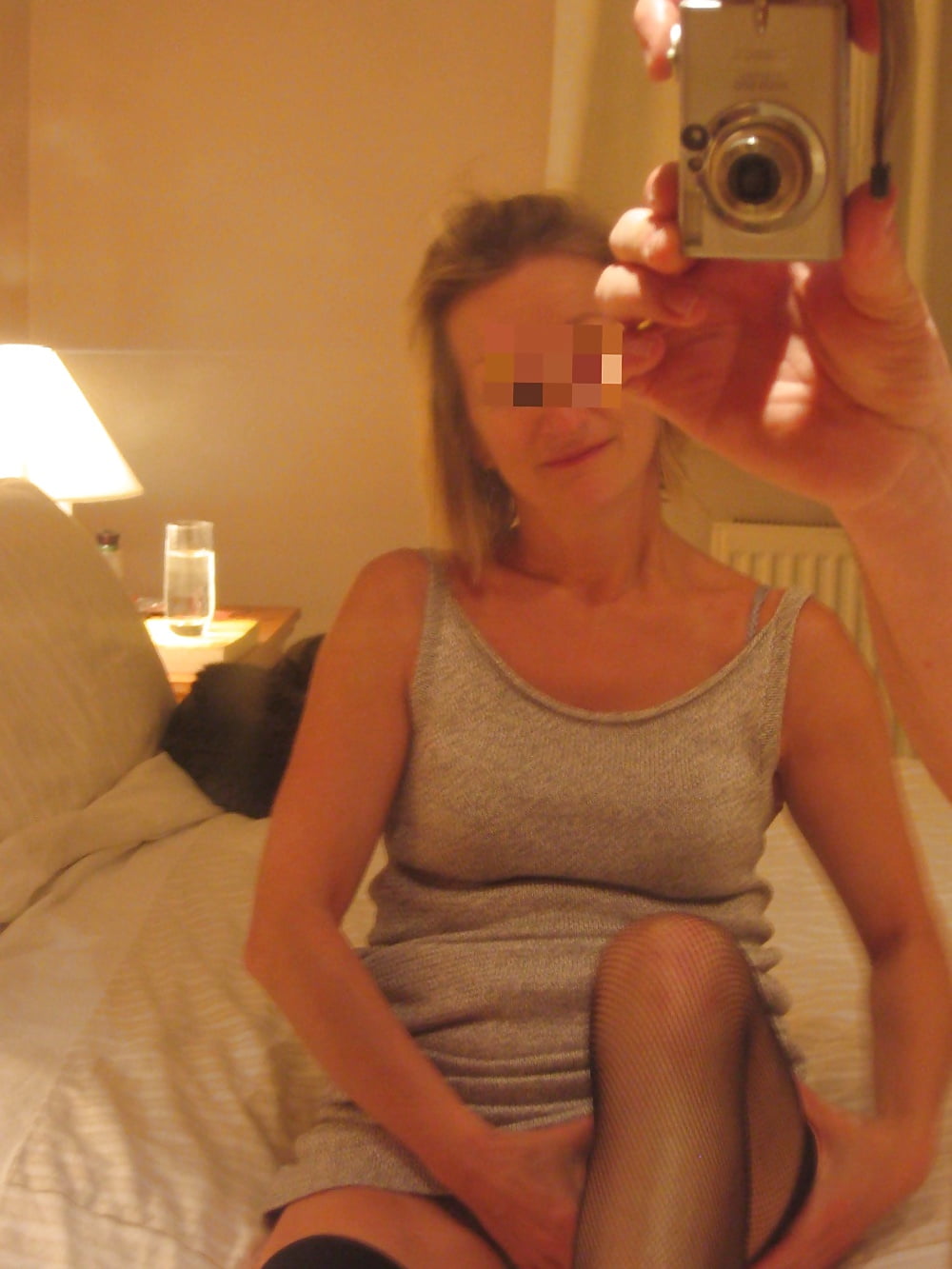 Sex UK milf stripping for her lucky hubby image