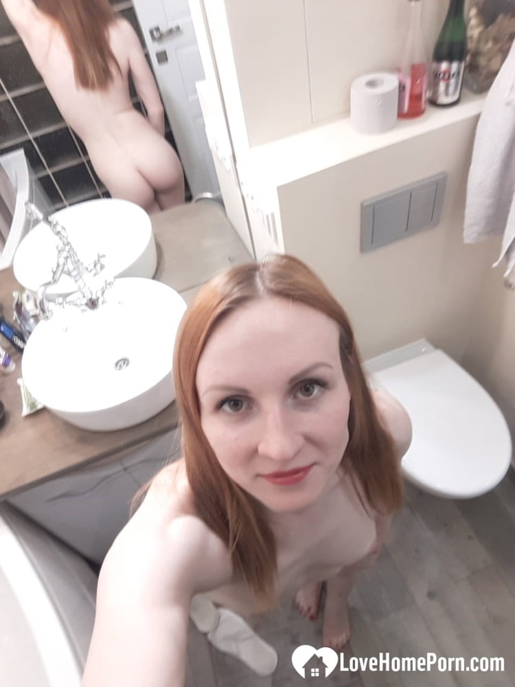 Skinny redhead with small tits in the mirror - 50 Pics 