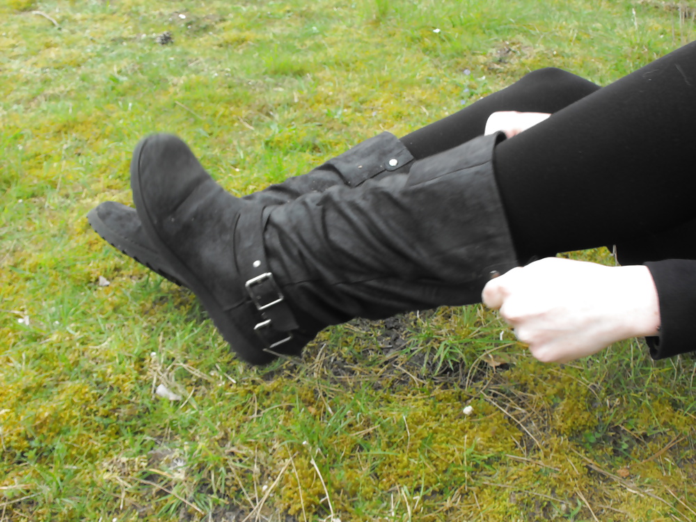 Sex Em showing her sexy feet in the forest in black tights image
