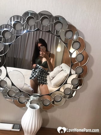 hot schoolgirl reveals her tits in the mirror         