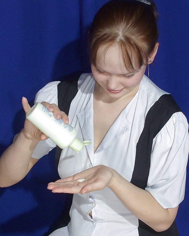Sex Busty russian amateur Dodo putting on some cream image