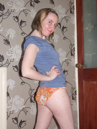 cute blonde posing in jeans and shirt         