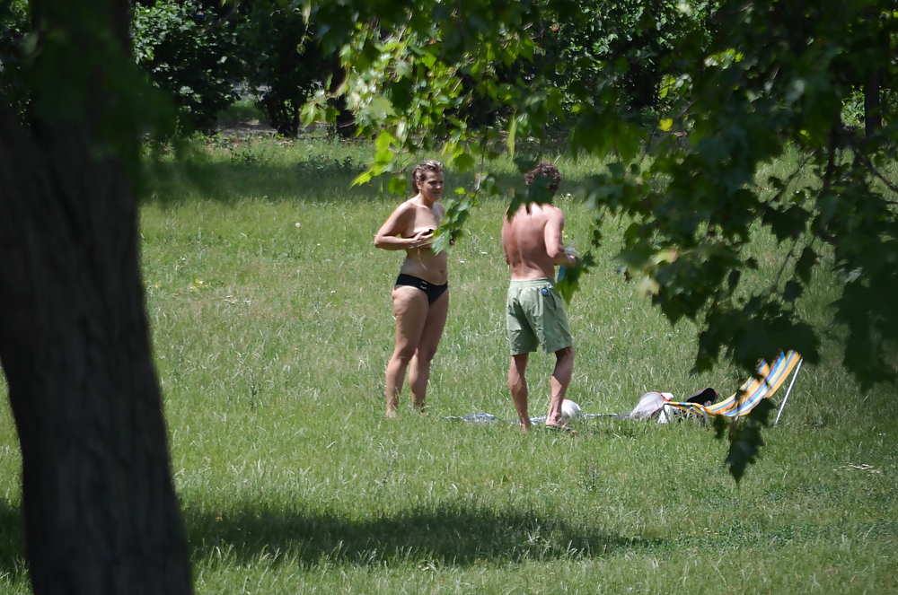 Sex girl sunbathing in the park I image